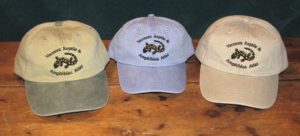 Three hats: bi-color, periwinkle, tan